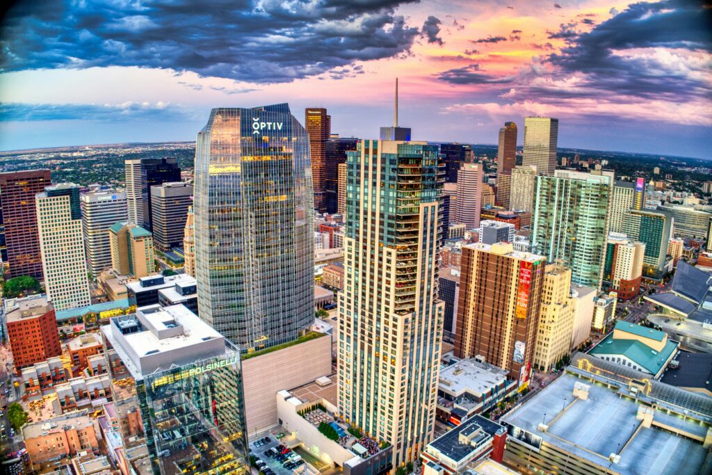 high rise buildings under white clouds and blue sky during daytime in Denver, Colorado