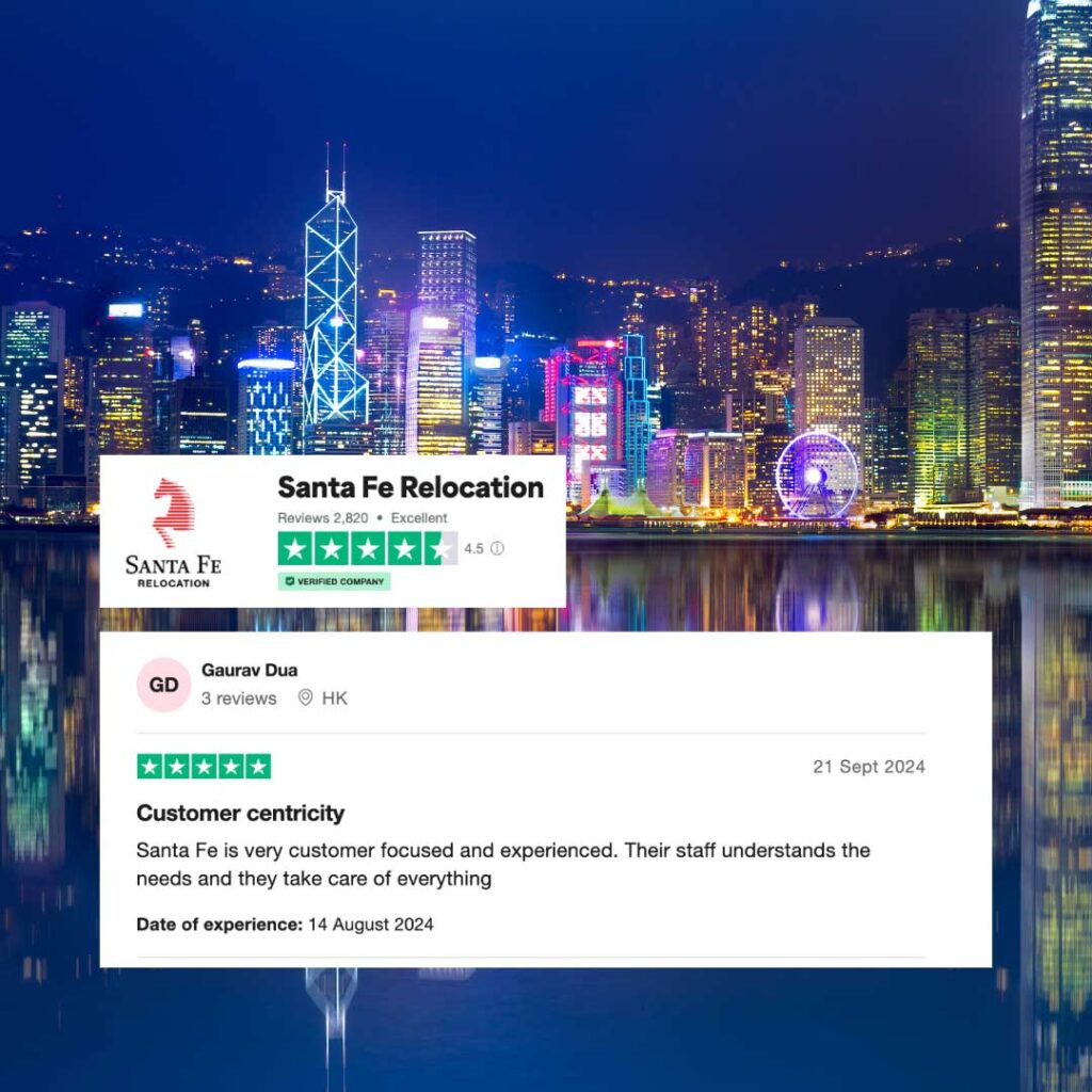 Night image of Hong Kong skyline with a Trustpilot review overlayed of a very happy customer after moving with Santa Fe