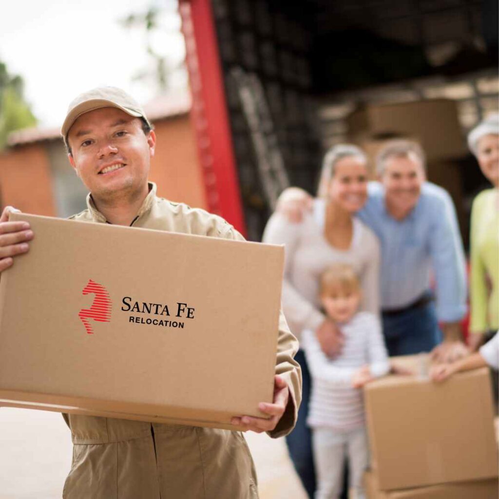 Moving Team with a Santa Fe box and a family excited to move into their new home