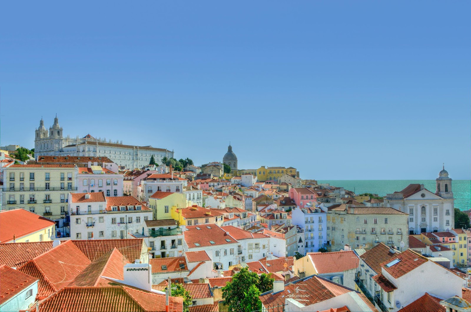 Aerial Photography of Brown-and-white Concrete Buildings Under Blue Sky in Lisbon