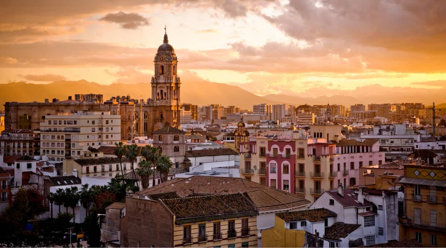 Sunset city view of Malaga in Spain. One of the top relocation destinations for 2025.