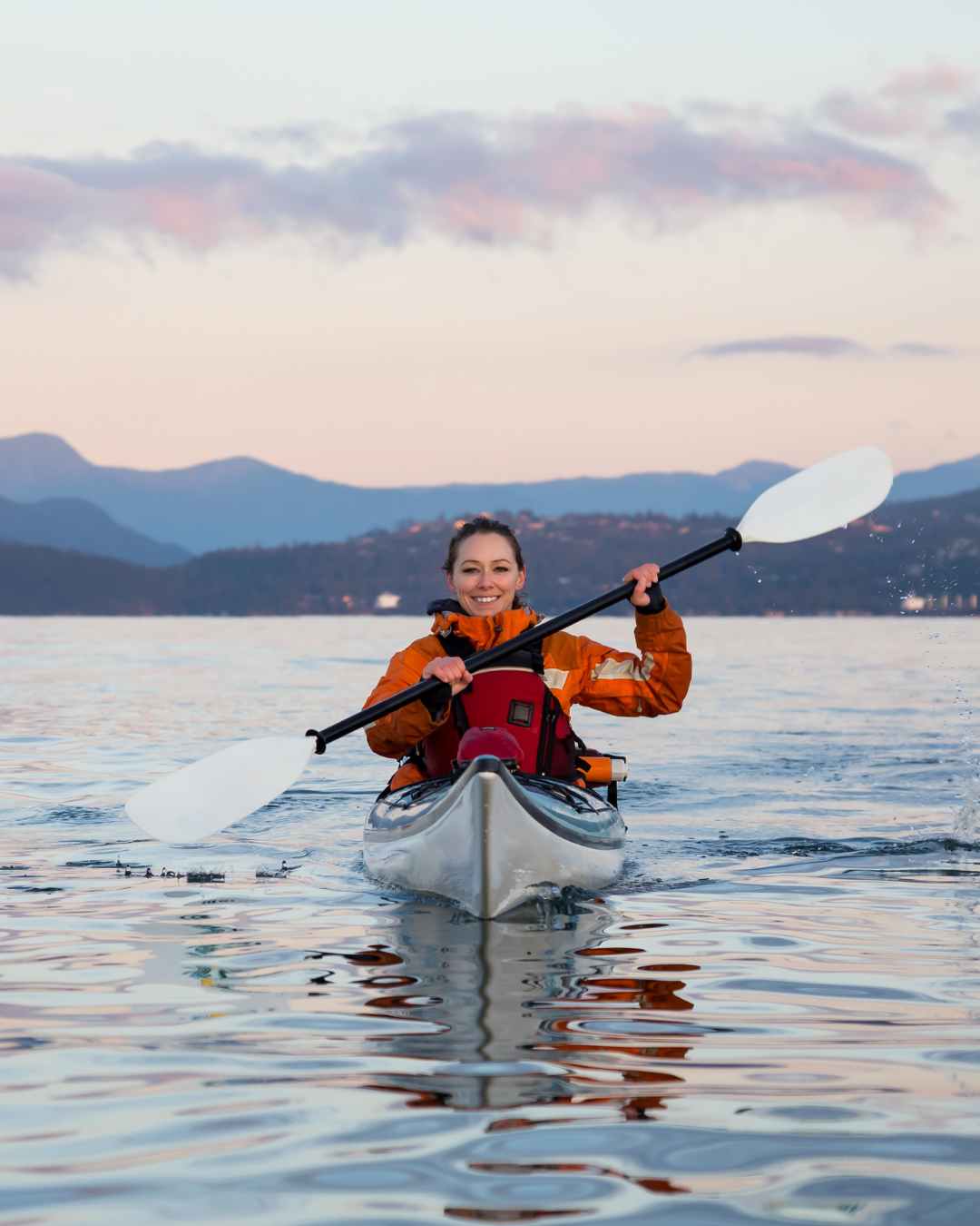 Kayaker enjoying the serene oceans in Vancouver, Canada.